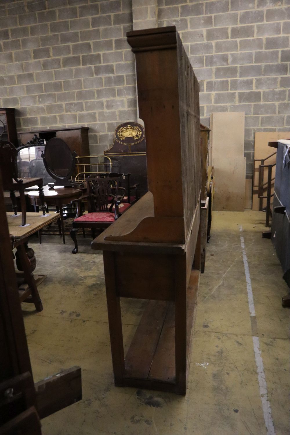 A late 18th century stripped pine dresser, width 182cm depth 50cm height 202cm
